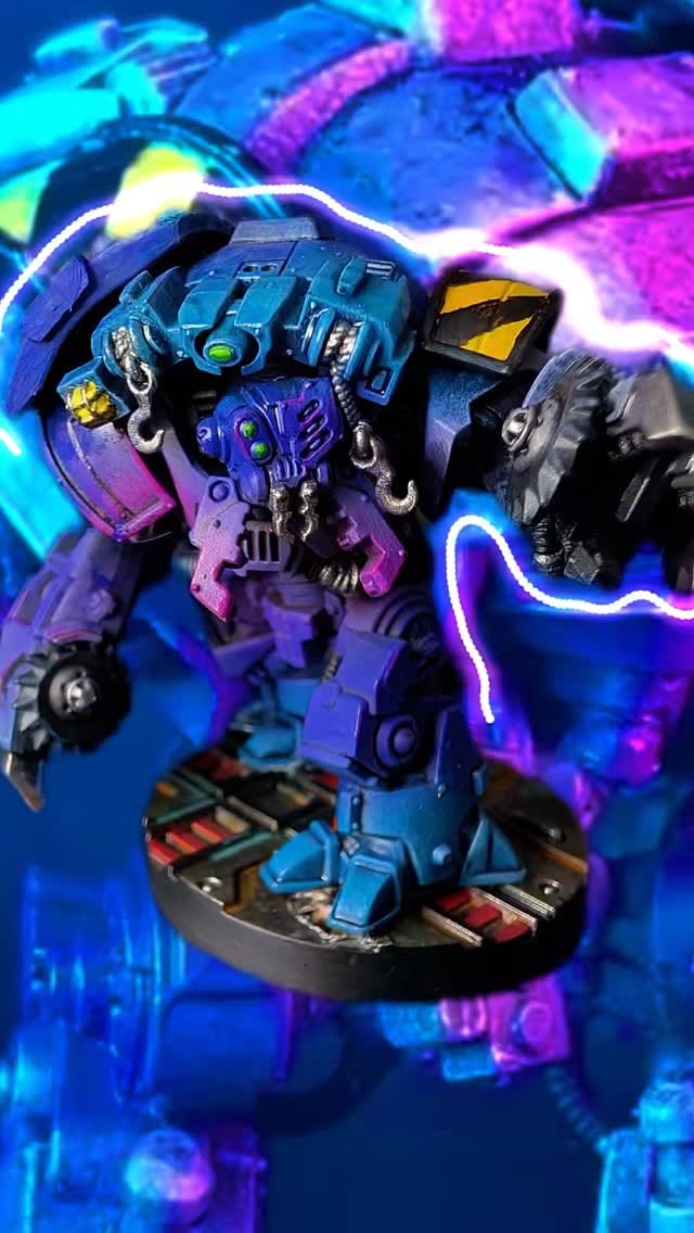 Ambot miniature painted in a neon vapourwave scheme with purple and cyan blends